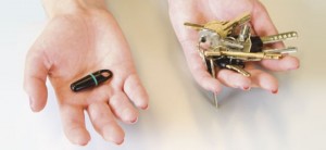 an image of two hands, one with keys and one with fobs