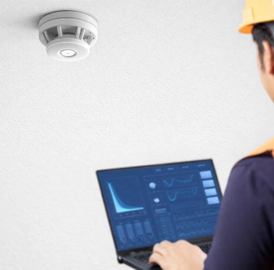 Technician monitoring a alarm connected to advanced wireless systems.